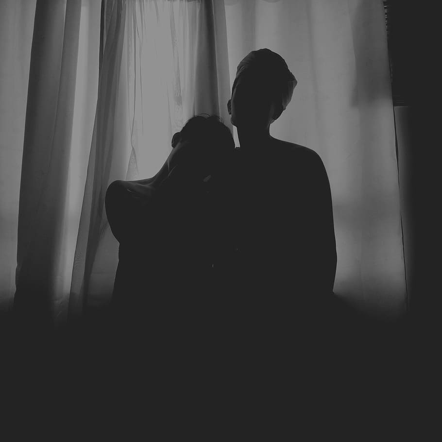 two human standing at the front of white curtain, silhouette photo of two person standing in front of window curtain