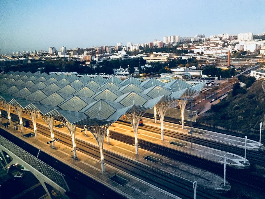 aerial photograph of railroad, photo of grey and white train station during golden hour HD wallpaper