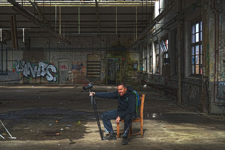 man sitting on chair holding camera, human, photographer, portrait, HD wallpaper