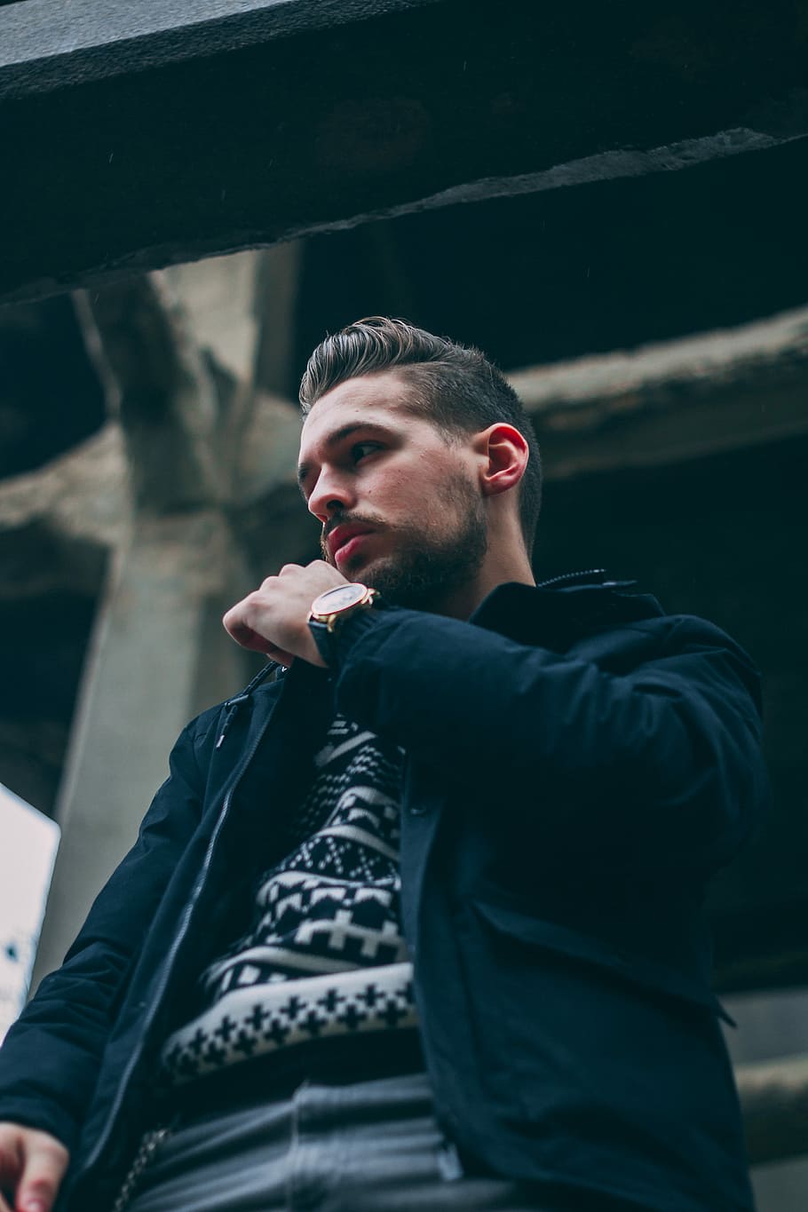 low angle photo of man in black jacket, man wearing jacket, patterned jumper HD wallpaper
