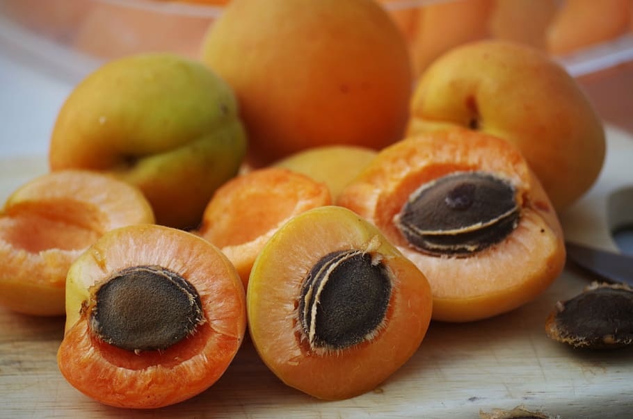bunch of orange fruits closeup photo, apricots, pips, sliced HD wallpaper