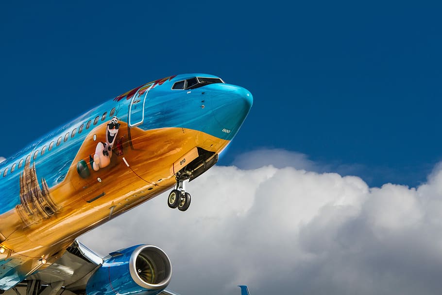 low angle photo of airliner plane, blue and orange flying airline during day time, HD wallpaper