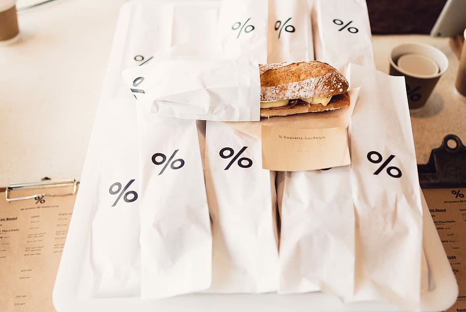 bunch of sandwich packs, bread on white paper packs, package HD wallpaper