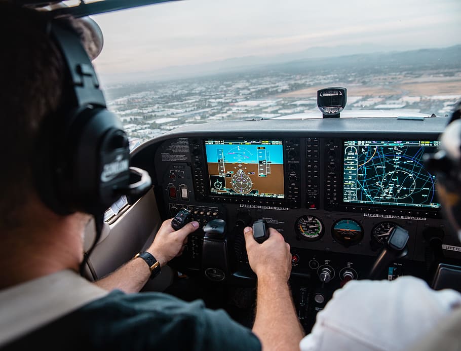 man flying aircraft under cloudy sky, man operating aircraft HD wallpaper