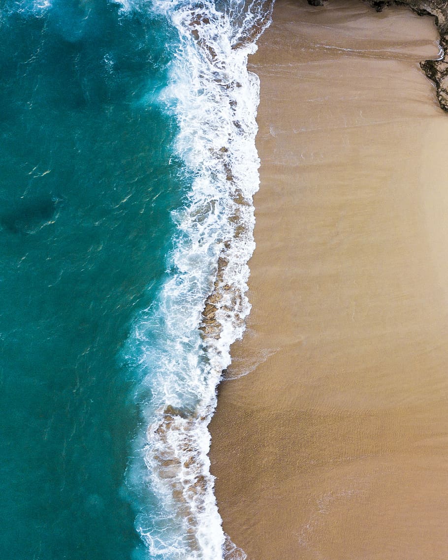 green and white sea beside sand, aerial view photography of body of water and sand HD wallpaper