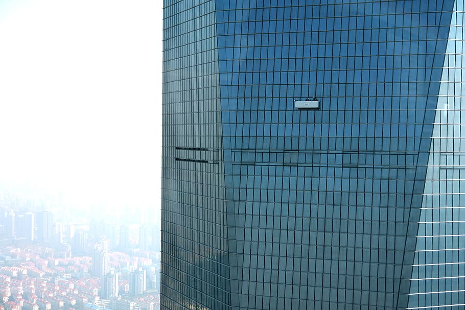 high-angle photography of concrete high-rise building at daytime HD wallpaper