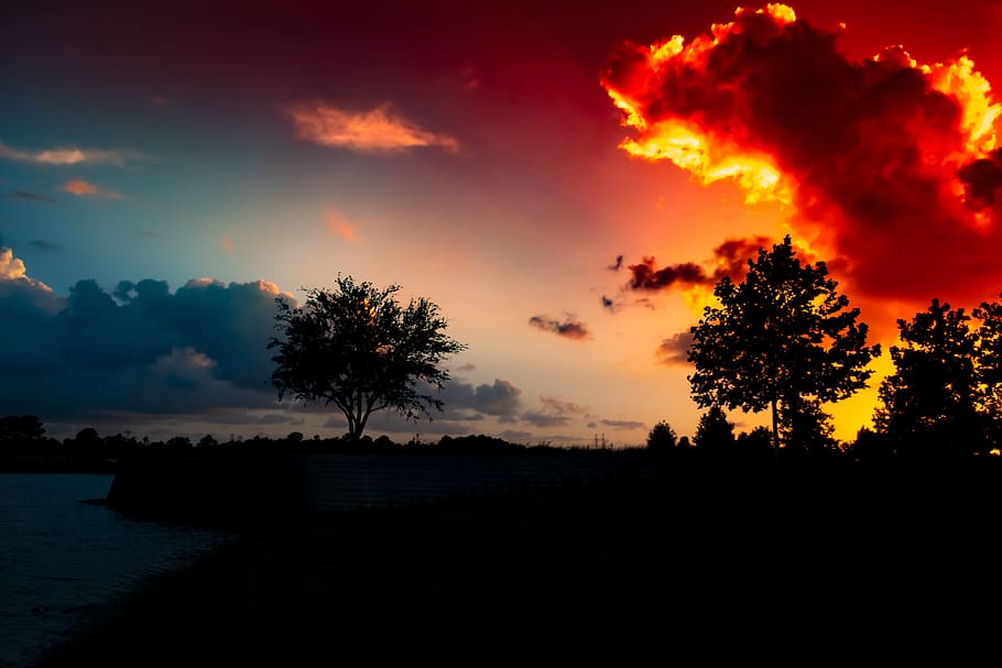 sunset, glowing red clouds, dramatic, sky, blue, bright, yellow HD wallpaper