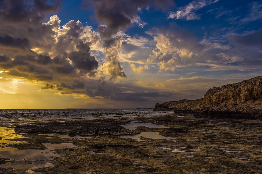 rock formation near sea at daytime, sky, clouds, dramatic, sunset HD wallpaper