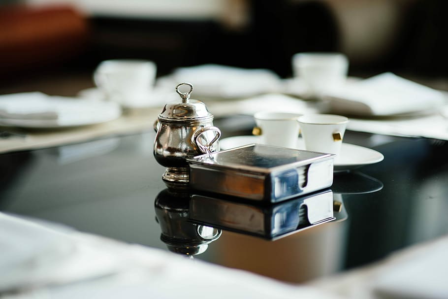 gray can near gray steel pot on black surface, square gray stainless steel holder and gray stainless steel delight pot in selective focus photography HD wallpaper