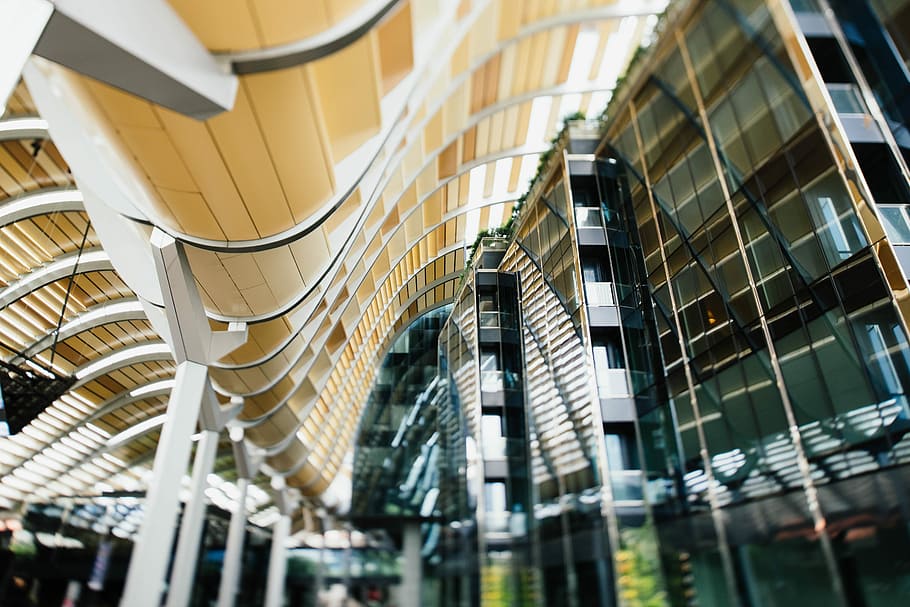 low angle photography of glass high rise buildings, low-angle photo of high-rise building HD wallpaper