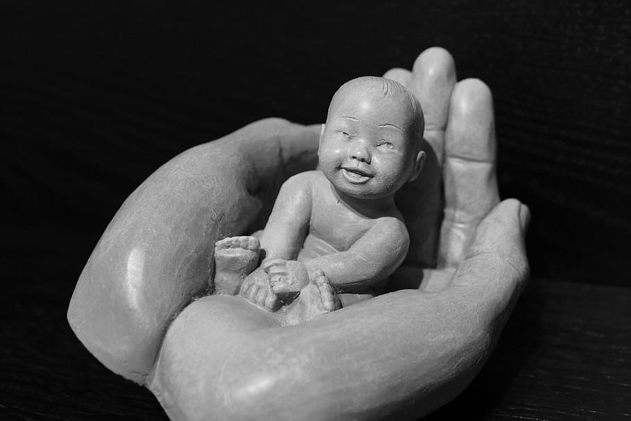 grayscale photo of baby on person's hand figurine, hands, open HD wallpaper