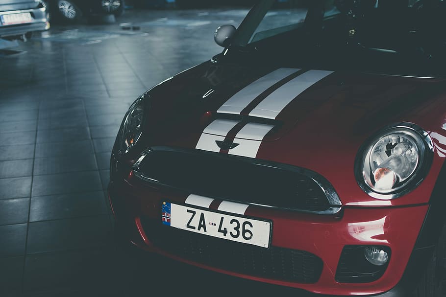 red and white Mini Cooper, red and white vehicle parks on gray ceramic pavement HD wallpaper