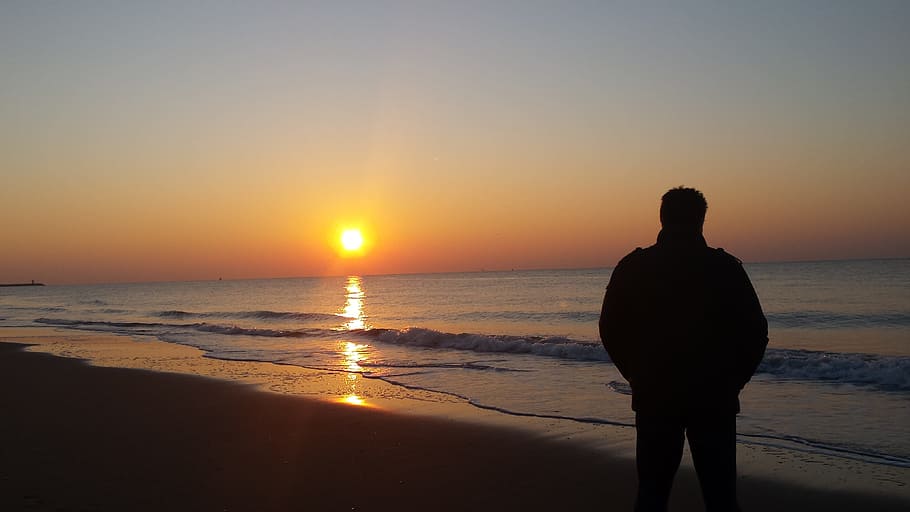 silhouette of person standing on beach, Sunset, Sea, Wave, Dusk HD wallpaper