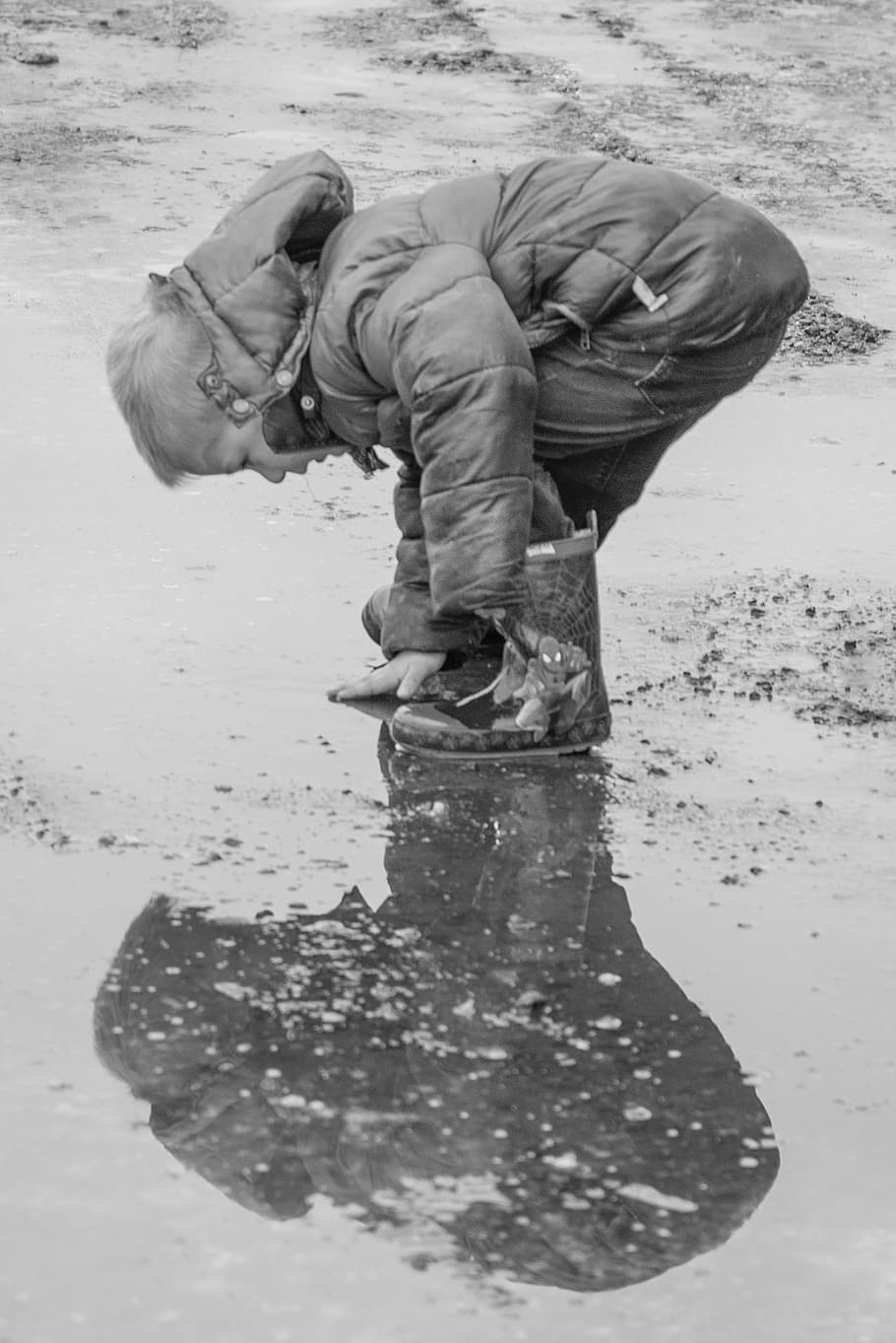 boy in bubble jacket reaching the floor, rain, water, reflection HD wallpaper