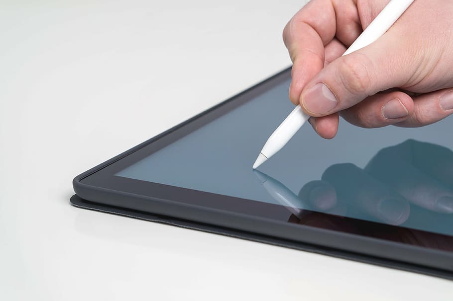 person holding white stylus, tablet, close up, banner, pencil