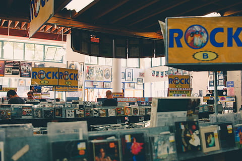 assorted-title jewel case lot on shekf, Rock store interior, Music HD wallpaper