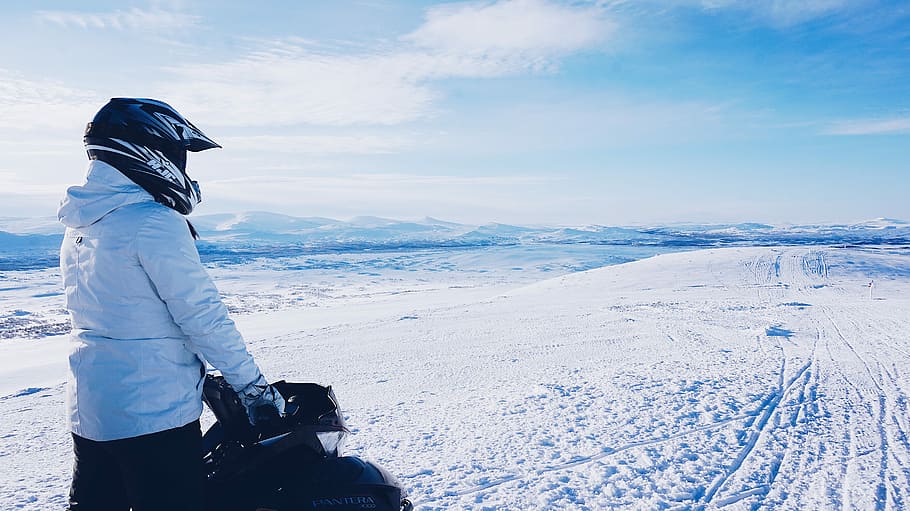 man riding snowmobile during daytime, helmet, white, sky, clouds, HD wallpaper