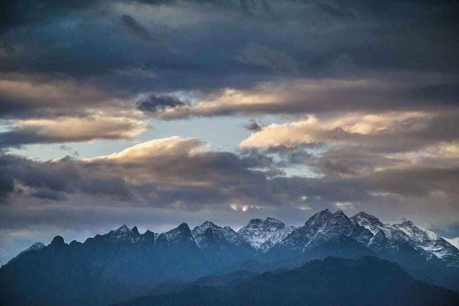 snowcap mountains under sky, mountain under cloudy blue sky during daytime HD wallpaper