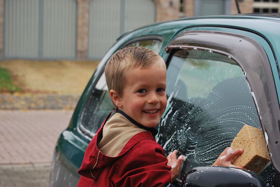 selective focus photography of boy washing car, sponge, laugh HD wallpaper