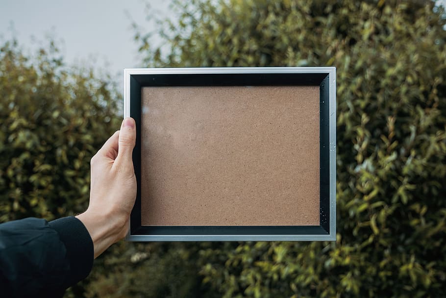 person holding rectangular white and black frame, Blank Memories HD wallpaper