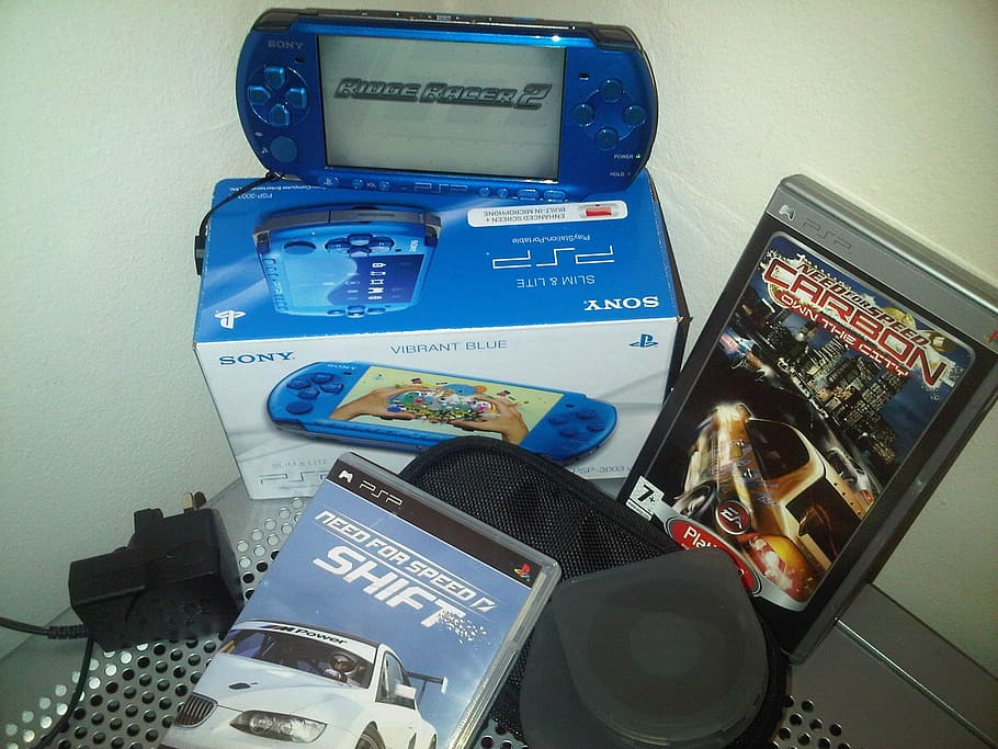 blue Sony PSP beside two game acses, Gaming Console, Game Console, HD wallpaper
