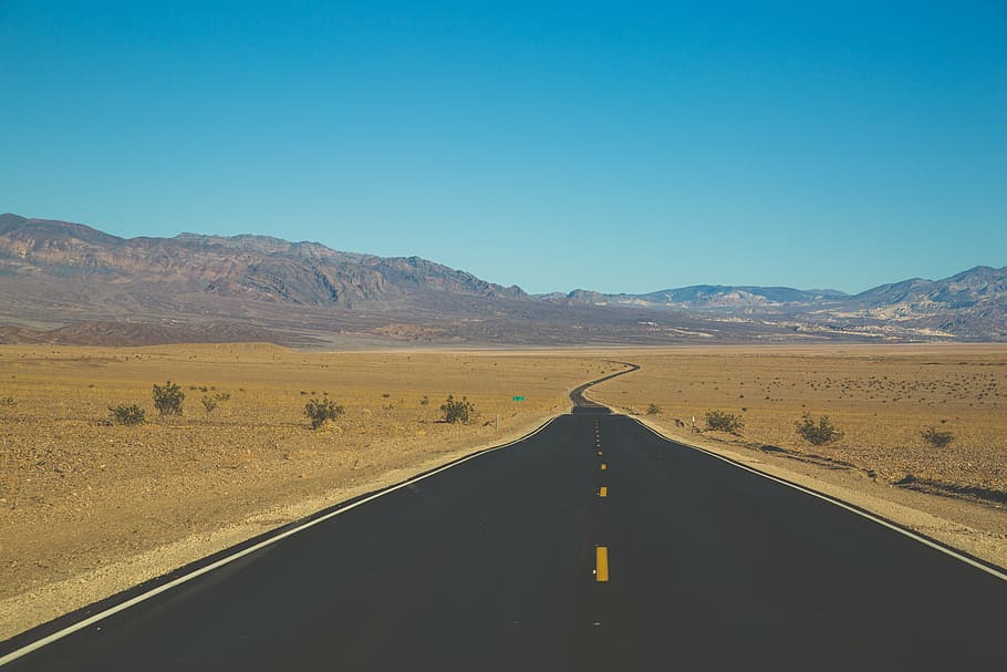 asphalt road surrounded by sand, dessert, path, mountains, plants HD wallpaper