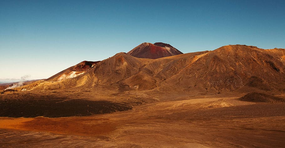 desert mountain under clear blue sky, brown hills under blue skies at daytime HD wallpaper
