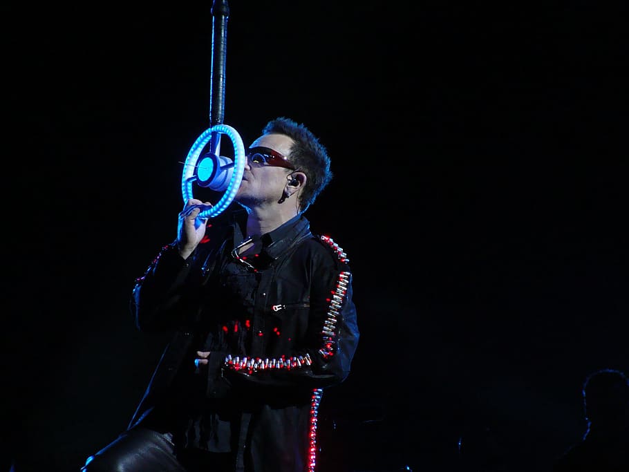 man wearing black jacket holding microphone, Paul David Hewson