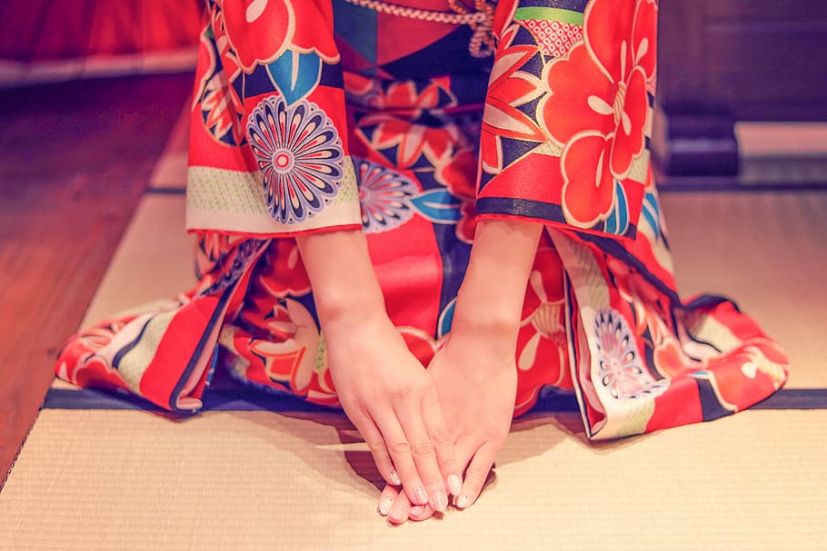 photo of woman wearing red floral traditional dress sitting on the floor \ HD wallpaper
