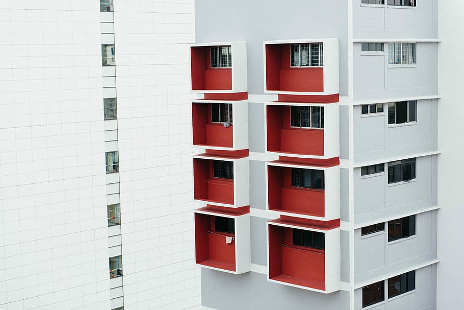 photograph of building structure, red and white high-rise building HD wallpaper