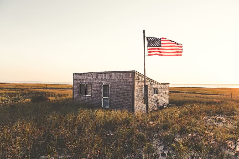 gray concrete house with USA flag, beach, sand, outpost, beach house HD wallpaper