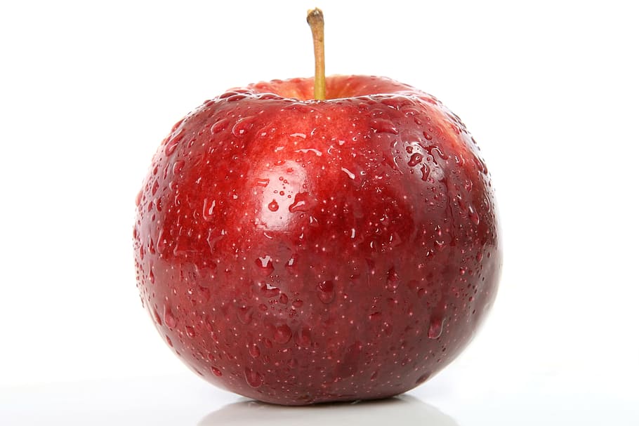 red apple fruit with dew drops in behind of white background