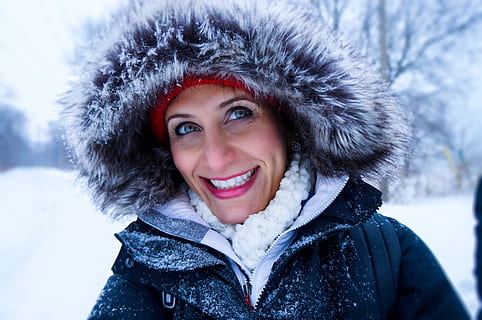 Close Up Photo of Woman Wearing Black Zip-up Parka Coat during Snow Season HD wallpaper