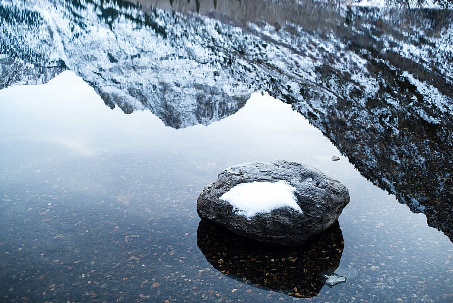 shallow focus photography of rock fragment on body of water, snow covered stone on body of water, HD wallpaper