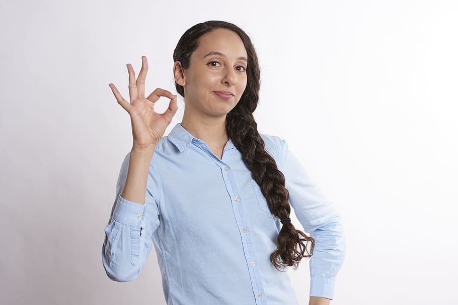 woman in blue dress shirt, ok, ok sign, a-ok, young, isolated