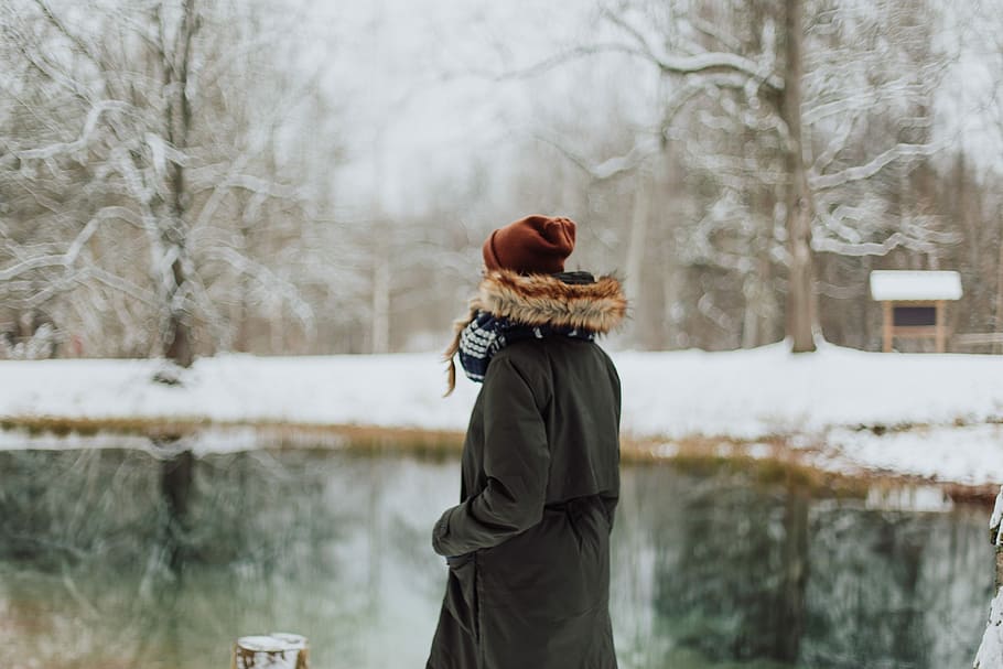 person standing near body of water, person in black parka coat standing near body of water HD wallpaper