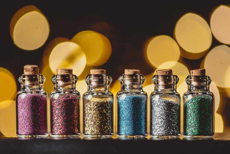 six assorted glitter in bottle, six glitters on vials with bokeh background HD wallpaper