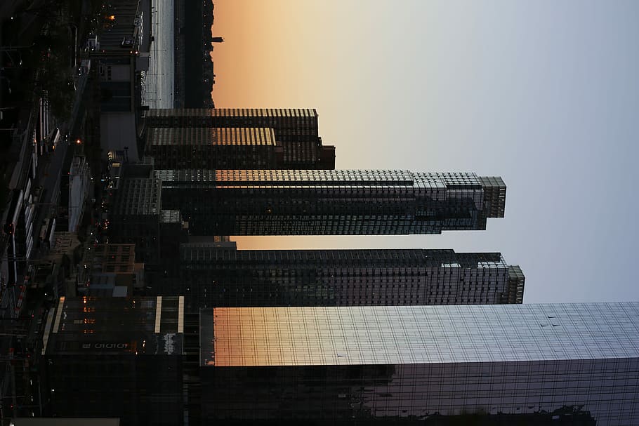 five curtain-wall buildings overlapping other buildings during golden hour photo, high rise building under golden hour HD wallpaper