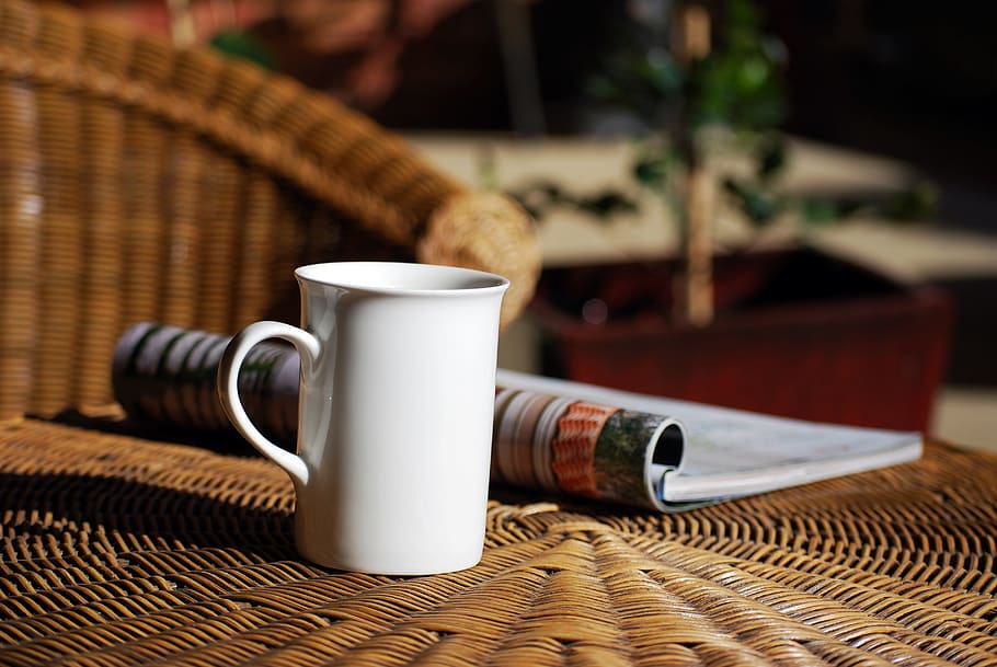 shallow focus photography of white ceramic mug on brown wicker table HD wallpaper