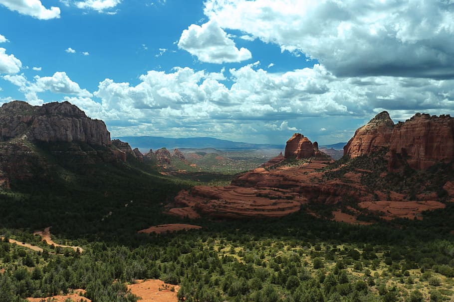 mountain peak during daytime, brown and green mountains under cloudy blue sky during daytime HD wallpaper