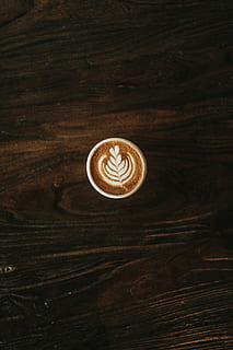 cappuccino latte art, white cup filled with coffee with leaf HD wallpaper