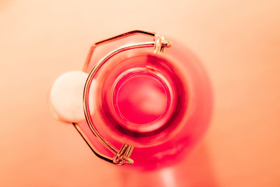 bottle, glass, circle, red, colored background, studio shot HD wallpaper