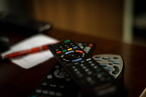 shallow focus photography of black remote controls, tv, television HD wallpaper