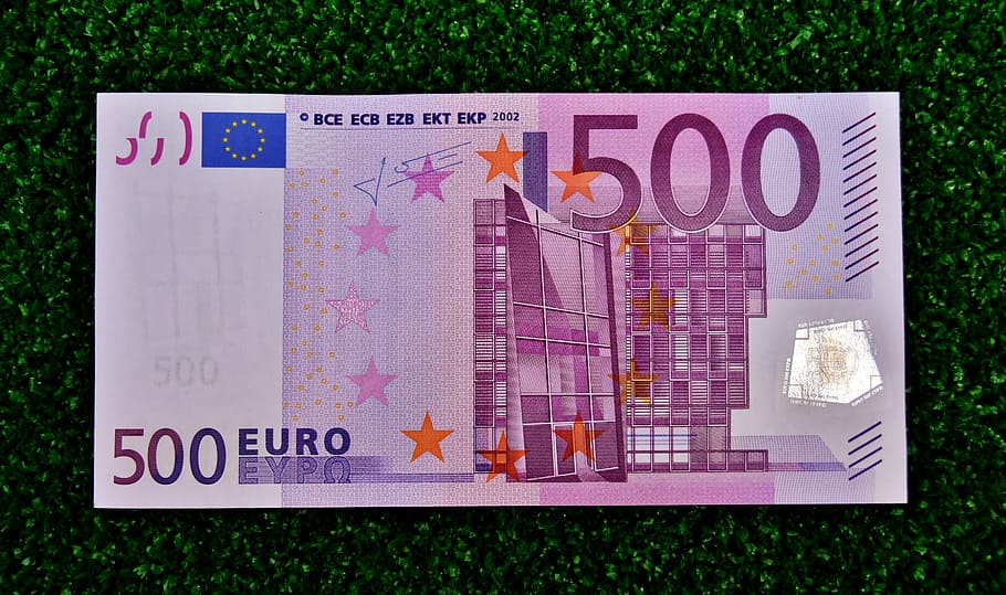 500 Euro banknote on green textile, dollar bill, money, currency