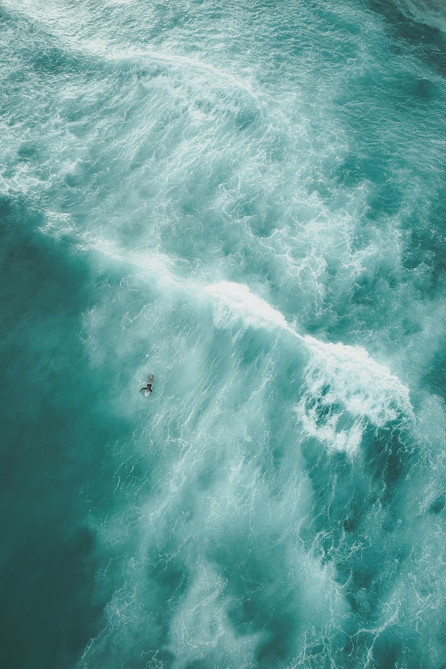 birds eye view photo of a person on body of water, person surfing aerial photography