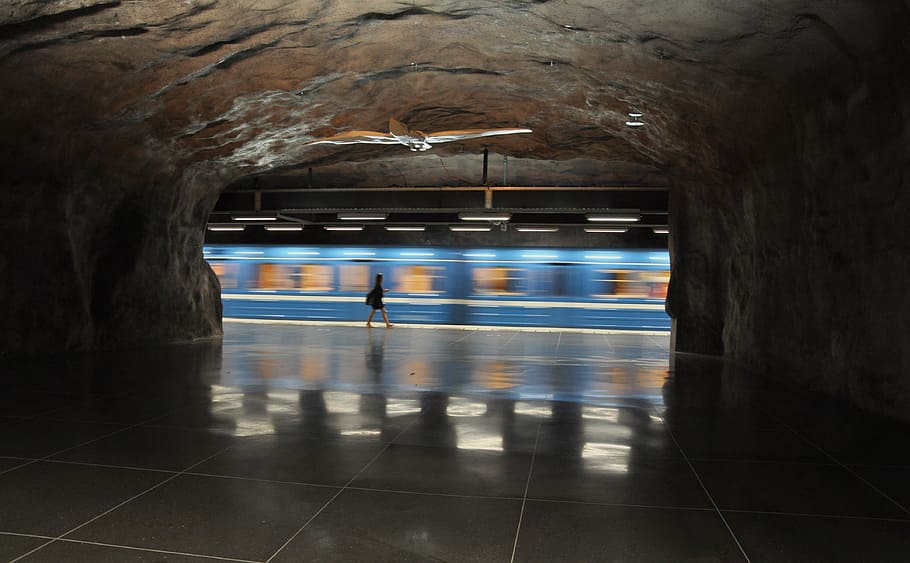 panning photography of woman walking near train, blue, subway, HD wallpaper