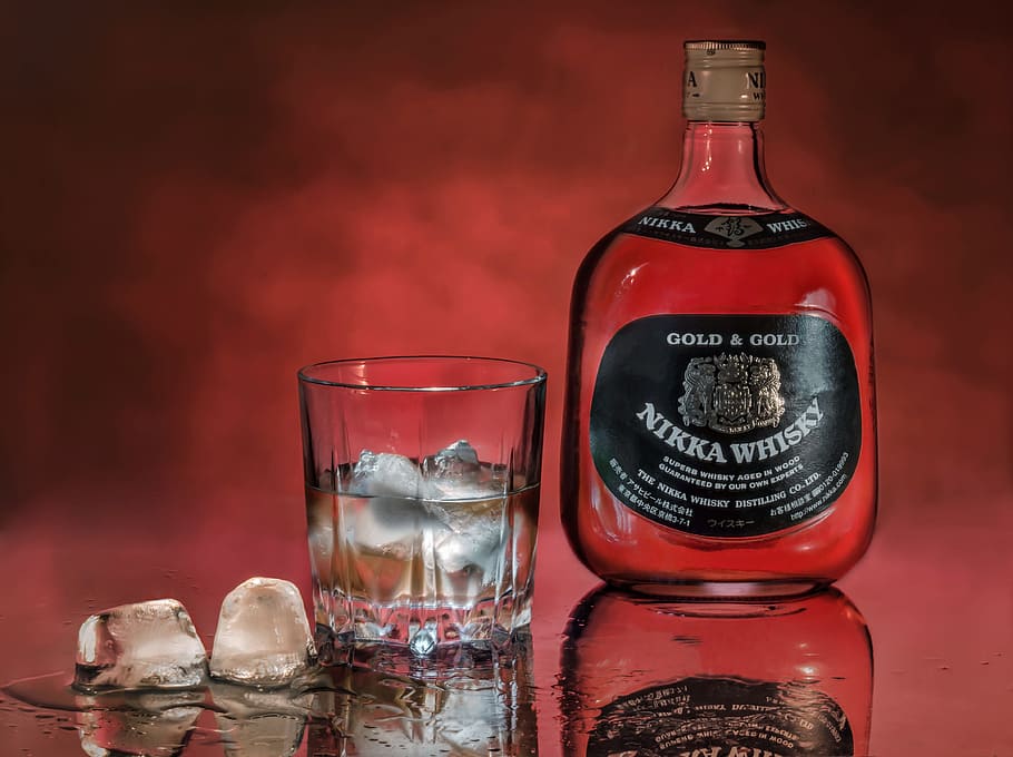 whiskey, ice, glass, bottle, red background, alcoholic beverage