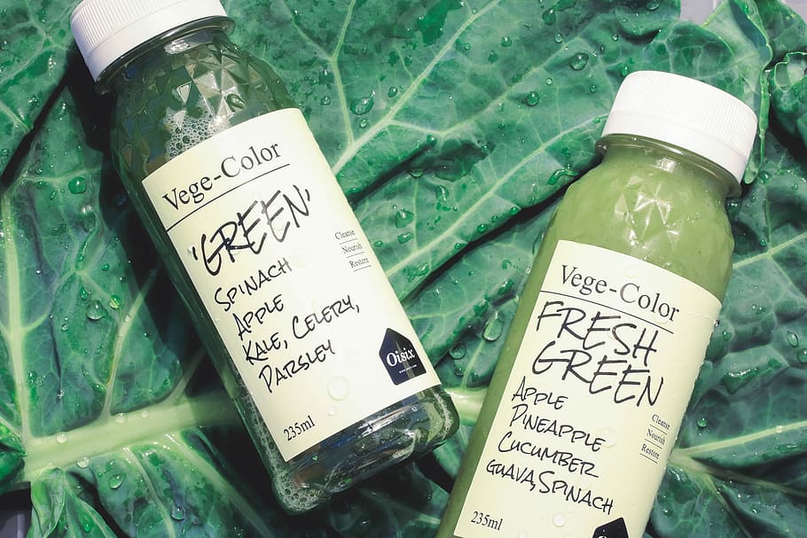 two Vege-Color Green and Fresh Green bottles on green leaf, currency HD wallpaper