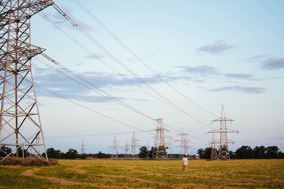 man standing near transmission towers, person, walking, bed HD wallpaper