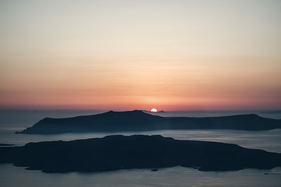 silhouette of mountain, landscape photography of body of water near mountain during night time HD wallpaper